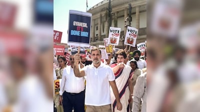 Rahul Gandhi holds ‘Gyanesh, it’s done, bro’ placard | Rahul Gandhi carried a placard with the message, “Gyanesh, it’s done bro!”, during the protest march. The Leader of Opposition in the Lok Sabha also posted the same message on X and added, “Time to resign.” (Image: PTI)
