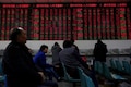 Asian shares wobble as China halts trade talks with US; oil rallies