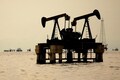Oil prices fall on rising US crude inventories, record production