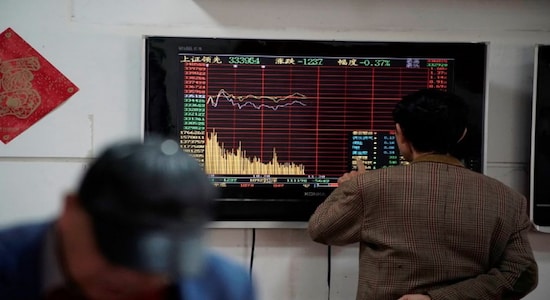Asian shares on defensive as plunging oil prices fan growth worries