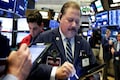 Wall Street ends near flat, but financials climb with yields