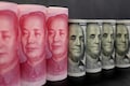 Dollar tenses for yuan fix as China eases policy