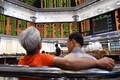 Asia shares mixed as China cuts rates and data disappoints