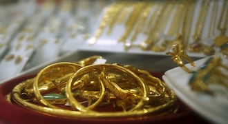 Gold prices fall by Rs 250 on weak global cues and low demand
