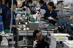 Japan's factory output rebounds from dismal start to quarter