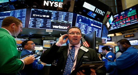 Traders work on the floor of the New York Stock Exchange (NYSE) in New York, U.S., May 18, 2018. REUTERS/Brendan McDermid