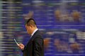 Asian shares win reprieve on Sino-US trade talk hopes