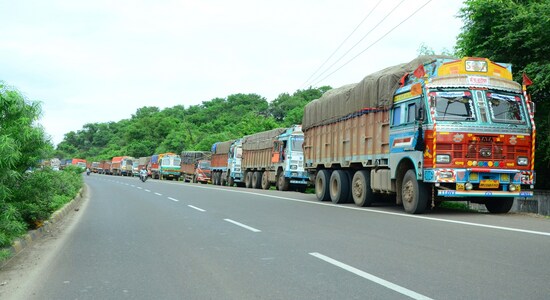 Nagpur : Trucks stranded on National Highway 6 between Nagpur and Amravati on July 20, 2018. Over 90 lakh trucks and around 50 lakh buses, tempos and tourist vehicles went off the roads on Friday as their owners began an indefinite strike to press for their various demands, including reduction in diesel prices. Pick-up or delivery of goods has been hit from manufacturing to consumer centres, cargo transport from airports, seaports and railway yards has been halted while movement of people in private buses and tourist vehicles was affected with even school-buses on strike. (Photo: IANS)