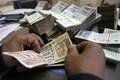 Rupee settles 4 paise higher at 73.54 against US dollar