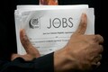 Applications for US unemployment benefits dip to 210,000, another sign the job market is strong