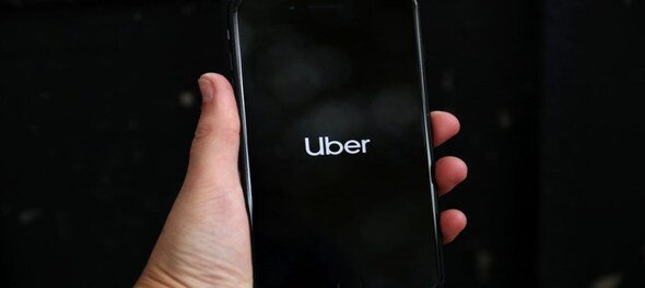 Uber turns cash flow positive for the first time, shares surge