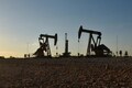Oil prices firm on trade hopes, but record US output drags