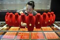 Gold slips as US-China trade war fears prop up dollar