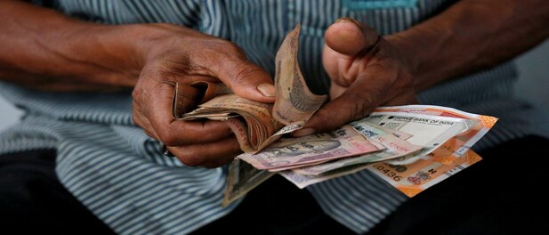 Rupee loses ground against a strong dollar, bond yields rise