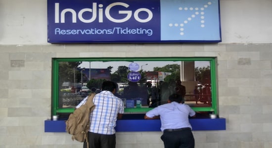 Passengers stand at the ticket counter of Indigo Airlines at the airport on the outskirts of Agartala, October 16, 2014. REUTERS/Jayanta Dey/Files