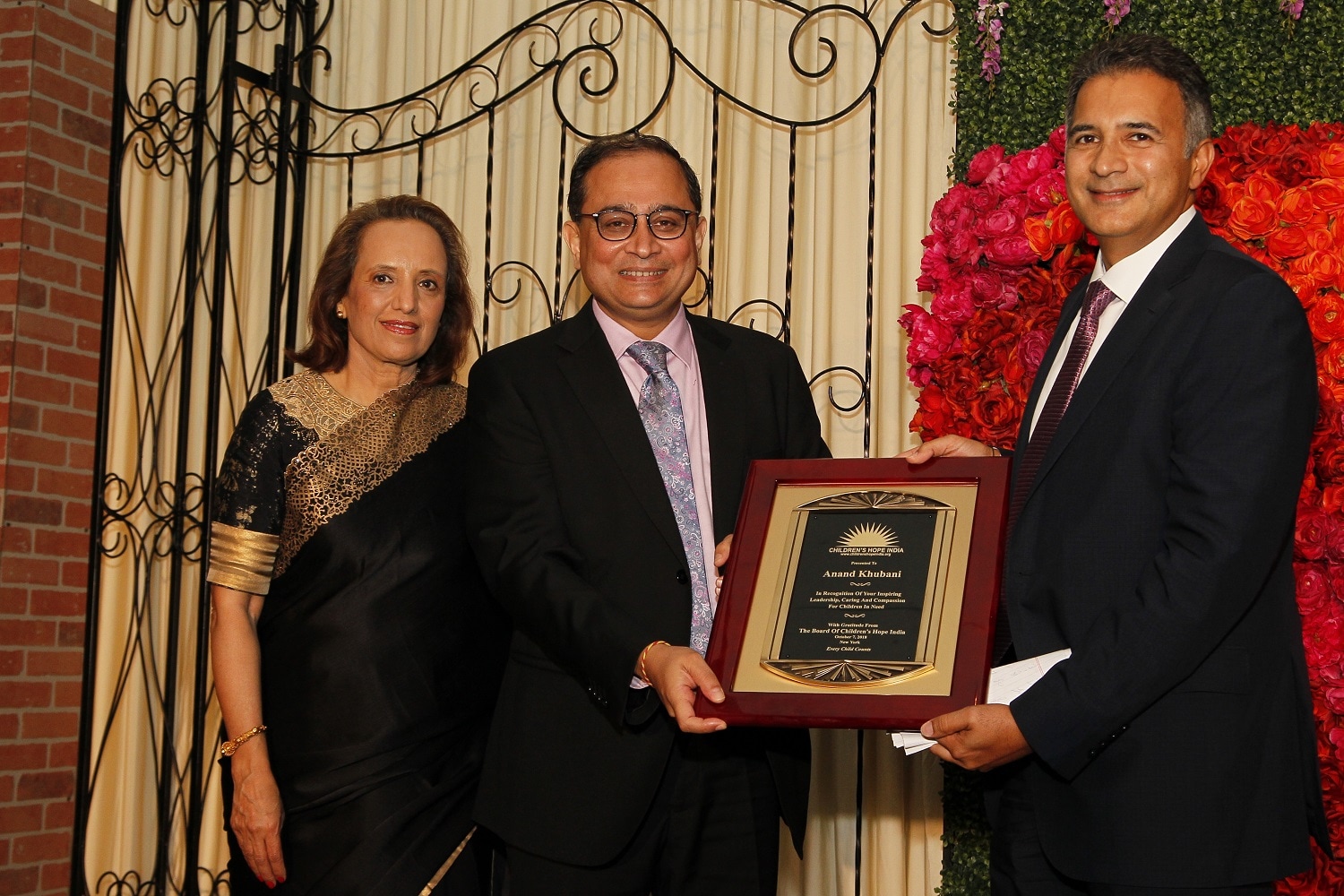 Lotus honoree Anand Khubani receives award from CG of India, Sandeep Chakravorty and CHI president Dr. Dina Pahlajani.