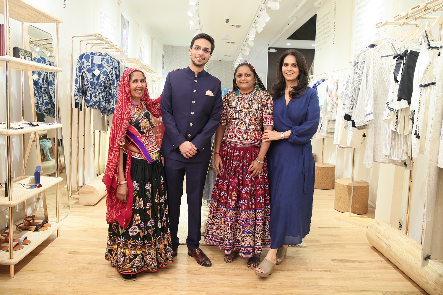Anita Dongre and Yash Dongre with village craftswomen at the opening of the Soho store.