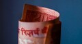 Rupee gains 10 paise to 68.86 a dollar in opening trade