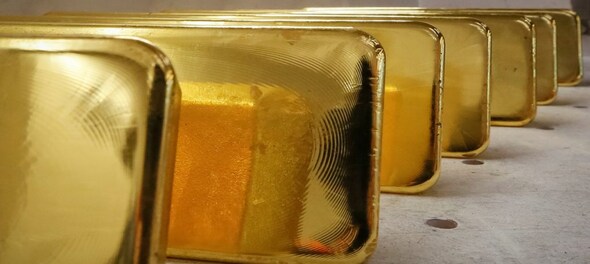 Global gold prices fall on US-China trade optimism but set for second weekly gain