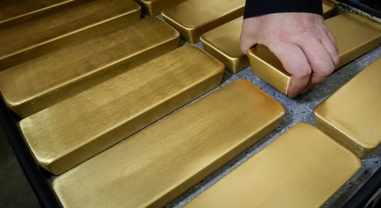 Gold pulls back from five-week high; palladium marches higher