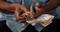 Rupee opens lower at 69.62 a dollar, bond yields rise