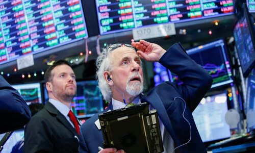 Wall Street ekes out gains despite drag from tech stocks
