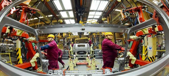China's factory output posts first increase for 2020 but consumption still weak