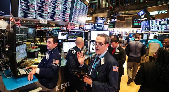 Wall Street slips, weighed down by healthcare plunge