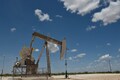 Oil prices edge down as global growth worries threaten demand