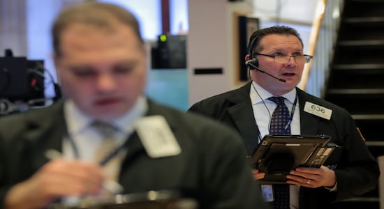 Traders work on the floor of the New York Stock Exchange (NYSE) in New York, U.S., January 10, 2019. REUTERS/Brendan McDermid