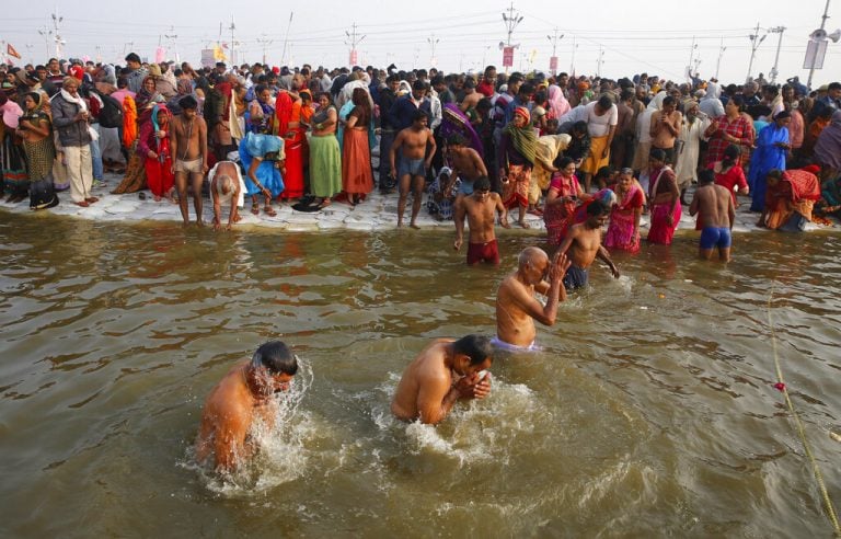 Image result for Devotees take holy dip on Makar Sankranti as Kumbh Mela opens