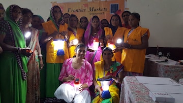 Ajaita (seated left) with her Solar Sahelis, whom she calls her ‘talvaar’. There are 2,500 of them across India.