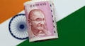 Rupee opens lower at 69 a dollar, bond yields rise