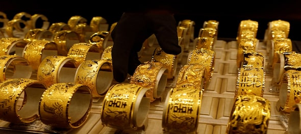 Gold remains flat despite firm trend overseas; silver slides Rs 70