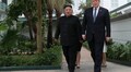 Trump, Kim go for brief walkabout after meeting, joined by envoys