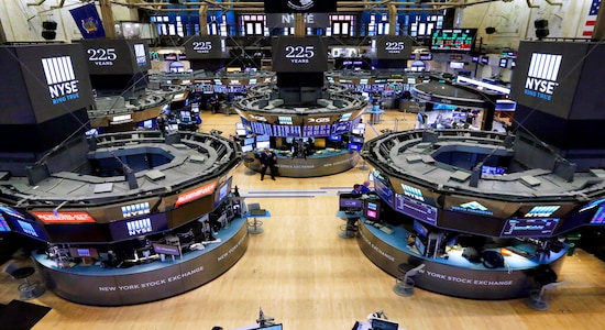 FILE - In this Oct. 18, 2017, file photo, traders work on the floor of the New York Stock Exchange. The bull market in stocks started with the U.S. still reeling from the Great Recession in March 2009. The bull turns 10 this weekend, having survived threats such as a debt crisis in Europe (2011), a slowdown in the Chinese economy (2015-2016), and fears of inflation and rising interest rates in the U.S. (AP Photo/Richard Drew, File) FILE - In this Oct. 18, 2017, file photo, traders work on the floor of the New York Stock Exchange. The bull market in stocks started with the U.S. still reeling from the Great Recession in March 2009. The bull turns 10 this weekend, having survived threats such as a debt crisis in Europe (2011), a slowdown in the Chinese economy (2015-2016), and fears of inflation and rising interest rates in the U.S. (AP Photo/Richard Drew, File)