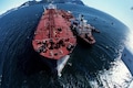 US warns merchant ships of possible Iranian attacks; cleric threatens US fleet