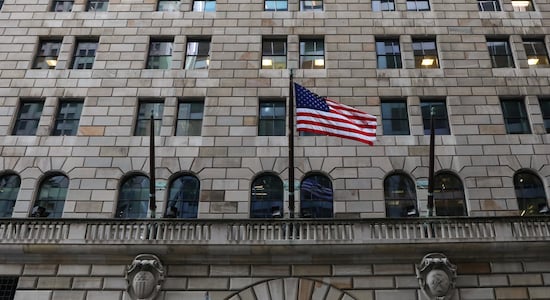 US flag flies on the Federal Reserve Bank of New York in the financial district in New York City