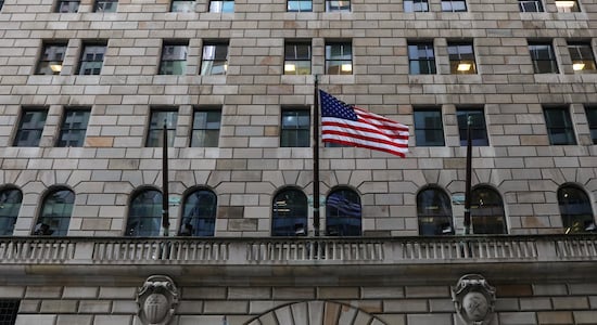 US flag flies on the Federal Reserve Bank of New York in the financial district in New York City US flag flies on the Federal Reserve Bank of New York in the financial district in New York City