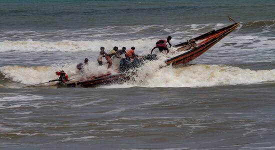 Puri: Fishermen try to control their boat amidst rough sea waters at Puri beach, Tuesday, April 30 2019. Cyclone 'Fani' in is likely to intensify into an 'extremely severe cyclonic storm' by late night and can hit the Odisha coast by Friday afternoon, the India Meteorological Department said Puri: Fishermen try to control their boat amidst rough sea waters at Puri beach, Tuesday, April 30 2019. Cyclone 'Fani' in is likely to intensify into an 'extremely severe cyclonic storm' by late night and can hit the Odisha coast by Friday afternoon, the India Meteorological Department said