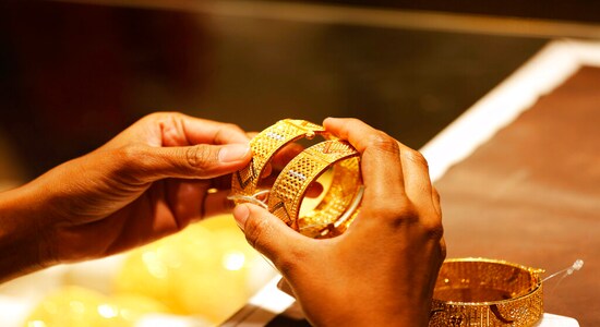 An Indian girl shops for gold bangles at a jewelry