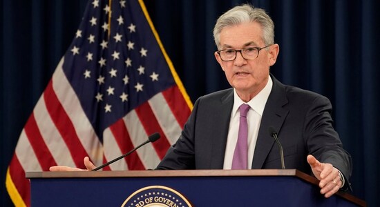 Jerome Powell says Fed is wrestling with whether to cut rates, insulated from politics