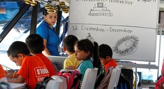 At US-Mexico border, a bus becomes a school for migrant children in limbo