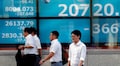Asian shares inch higher, new wave of infections a worry