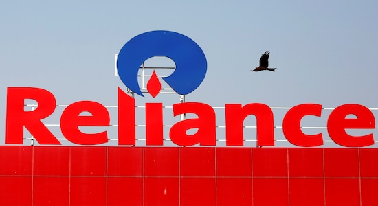 FILE PHOTO - A bird flies past a Reliance Industries logo installed on its mart in Ahmedabad, India January 16, 2017. REUTERS/Amit Dave/File Photo FILE PHOTO - A bird flies past a Reliance Industries logo installed on its mart in Ahmedabad, India January 16, 2017. REUTERS/Amit Dave/File Photo
