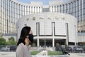 China's central bank tries to stop surge in currency's value