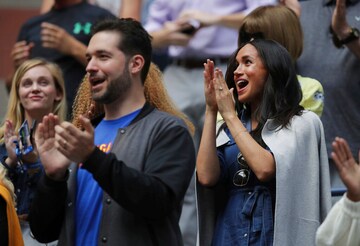 Meghan, Duchess of Sussex, right, and Alexis Ohanian, left, applaud as players are introduced before the start of the women's singles final of the U.S. Open tennis championships between Serena Williams, of the United States, and Bianca Andreescu, of Canada, Saturday, Sept. 7, 2019, in New York. (AP Photo/Charles Krupa)