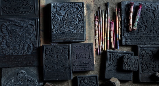 In this July 31, 2019, photo, wooden stamps which are used to make traditional paintings are displayed at the residence of Chitrakar couple Tej Kumari and Purna, in Bhaktapur, Nepal. Chitrakar families in the Nepalese capital of Kathmandu were renowned traditional painters and sculptors who depicted gods and goddesses on temples, masks of Hindu deities and posters for various religious celebrations. For the Chitrakar couple it is a struggle to keep the dying art alive against the modern mass produced prints. (AP Photo/Niranjan Shrestha)