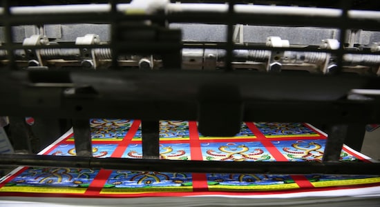 In this Aug. 2, 2019, photo, machine printed posters get ready ahead of Naag panchami festival at a printing press in Kathmandu, Nepal. The art and tradition of Nepal’s Chitrakar families, who depicted gods and goddesses on temples, masks of Hindu deities and posters for various religious celebrations is dying because of mass machine printed posters and card-size pictures of gods that are cheaper and more popular. (AP Photo/Niranjan Shrestha) In this Aug. 2, 2019, photo, machine printed posters get ready ahead of Naag panchami festival at a printing press in Kathmandu, Nepal. The art and tradition of Nepal’s Chitrakar families, who depicted gods and goddesses on temples, masks of Hindu deities and posters for various religious celebrations is dying because of mass machine printed posters and card-size pictures of gods that are cheaper and more popular. (AP Photo/Niranjan Shrestha)