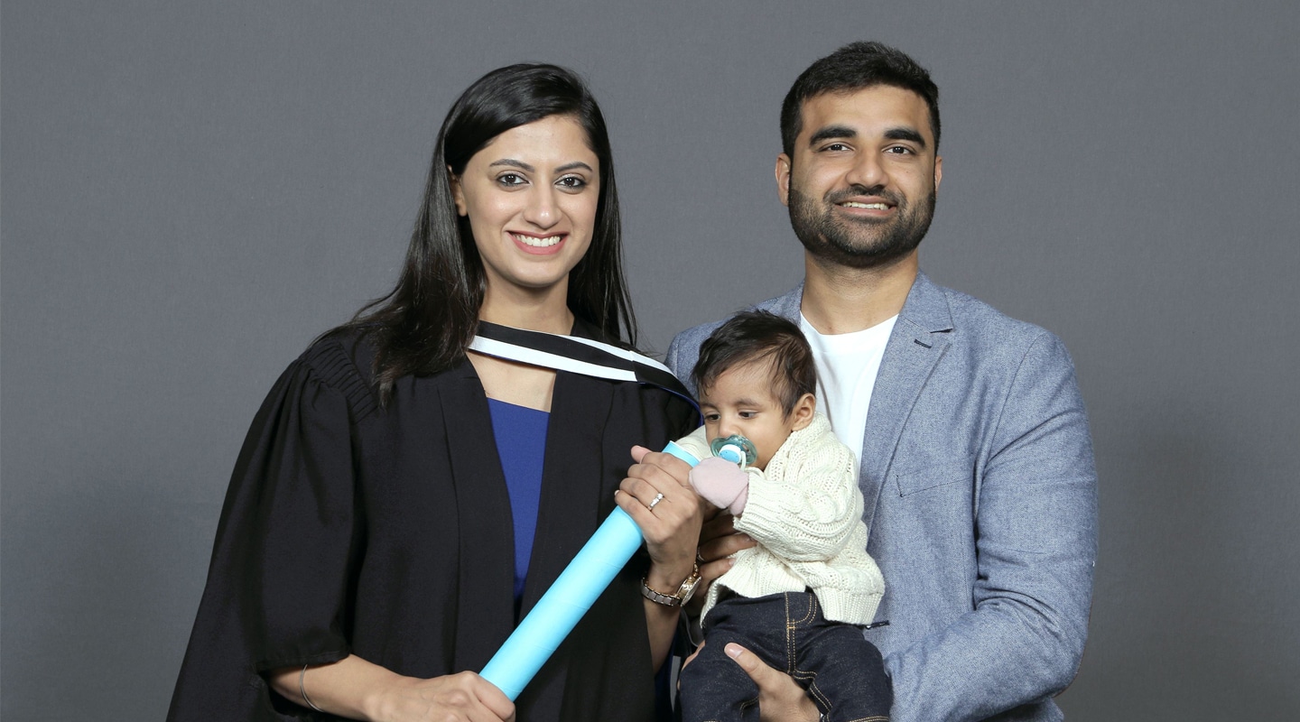Vidushi holding her Master’s degree with baby Meir and husband Apoorv